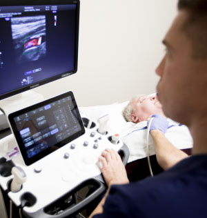 Transmed Ultrasound Tech Scanning Patient